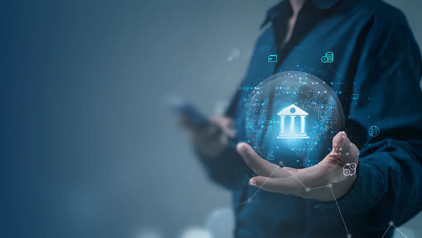 Hand holding a glowing digital globe with a bank icon